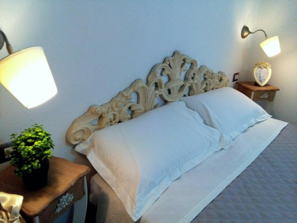 Łóżko lub łóżka w pokoju w obiekcie La Casetta Holiday Home
