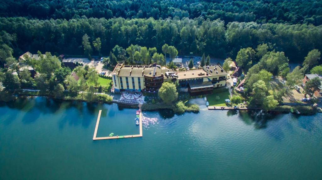 an aerial view of a house on an island in the water at Shuma in Dąbrowa Górnicza