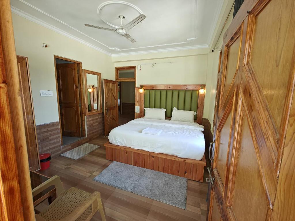 Ένα ή περισσότερα κρεβάτια σε δωμάτιο στο Qpoint hotel