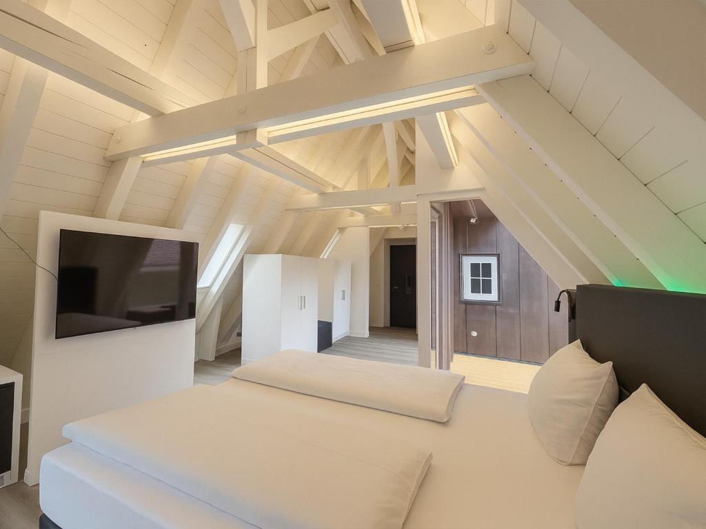 Postel nebo postele na pokoji v ubytování DORMERO Hotel Schwäbisch Hall