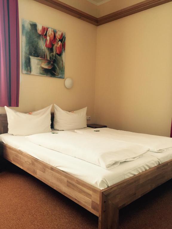 Postel nebo postele na pokoji v ubytování Hotel Gerber