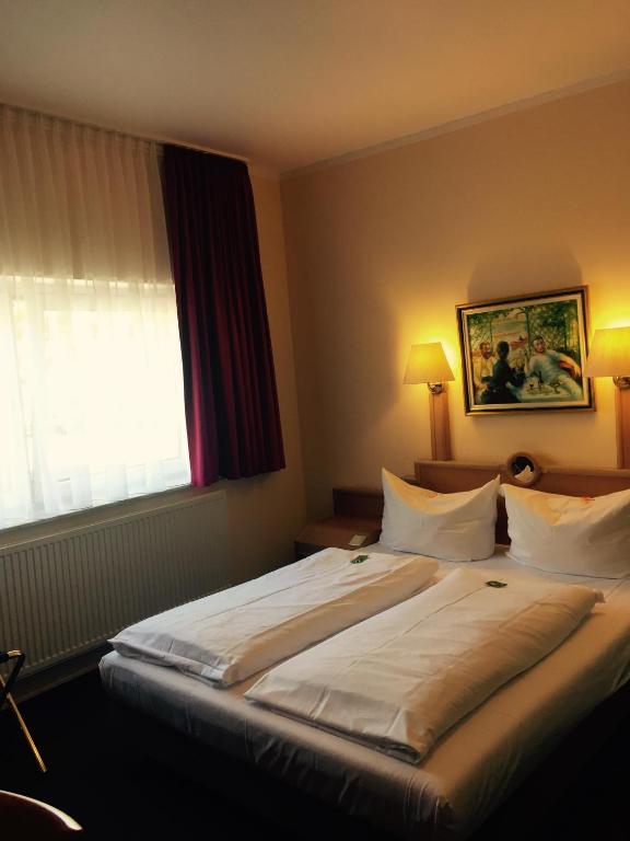 Postel nebo postele na pokoji v ubytování Hotel Gerber