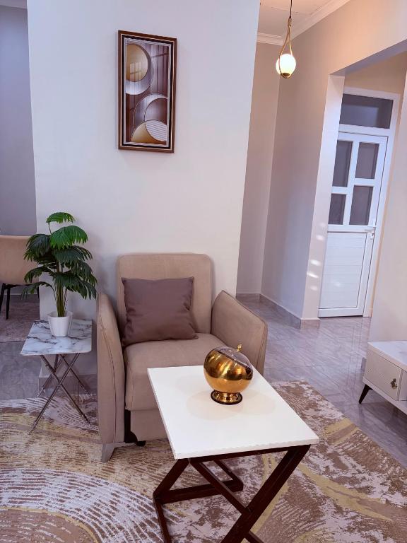 a living room with a couch and a table at Blesauz Apartments in Dar es Salaam