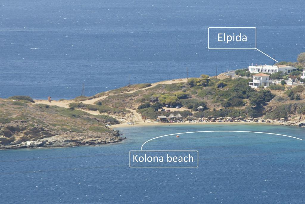 an island in the ocean with thereekreek word epuba and kota beach at Elpida Andros in Batsi