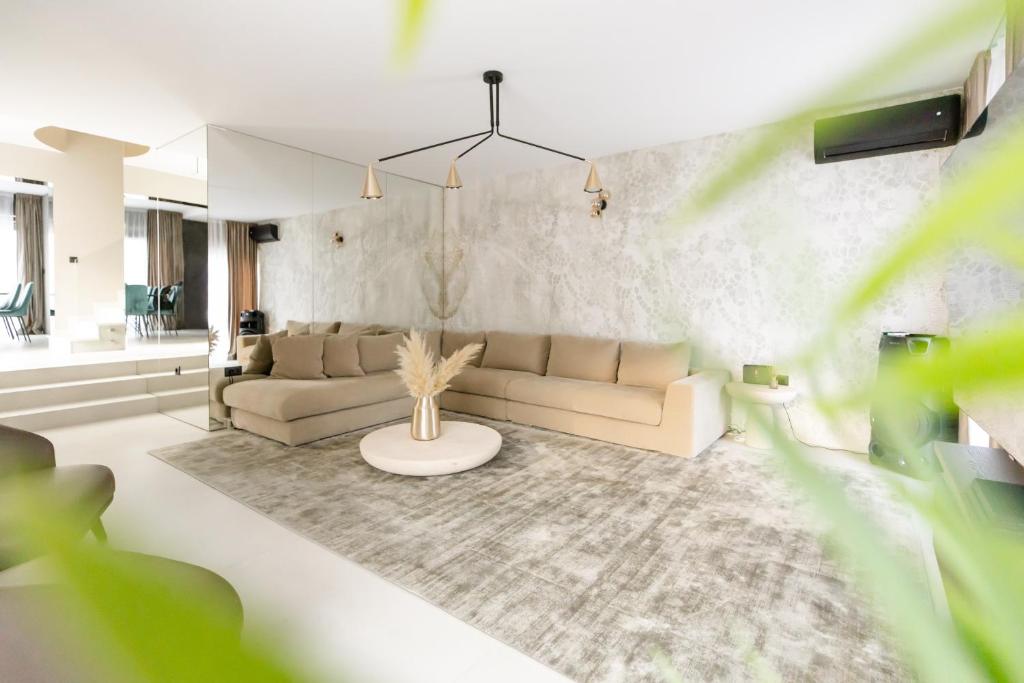 a living room with a couch and a table at Luxury Villa Positiva in Vir