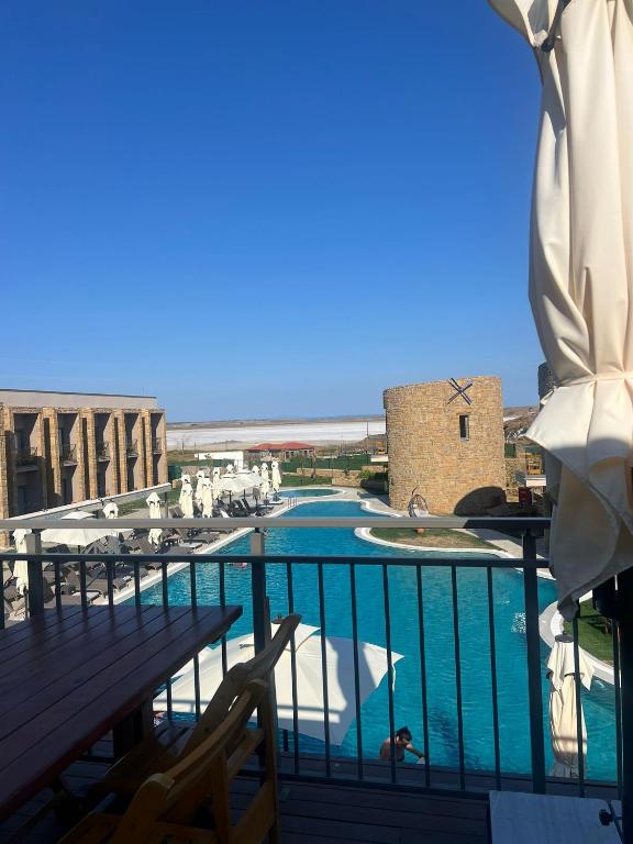 a view of the pool from the balcony of a resort at Blue Inn Hotel in Gökçeada