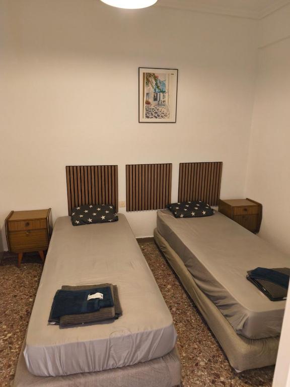 a room with two beds in a room at Central Michaniona AP in Nea Michaniona