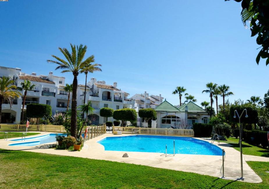 a swimming pool in front of some apartments at Appartment Penthouse 7- 6 in La Cala de Mijas