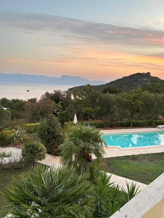 a swimming pool with a view of the ocean at Villa Valentina in Trpanj