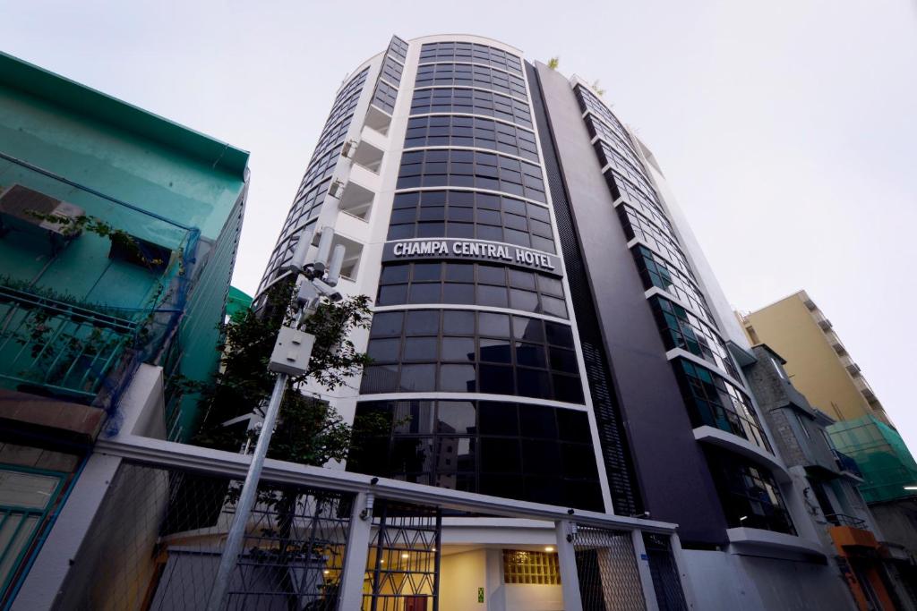 a building with a sign on the side of it at Champa Central Hotel in Male City