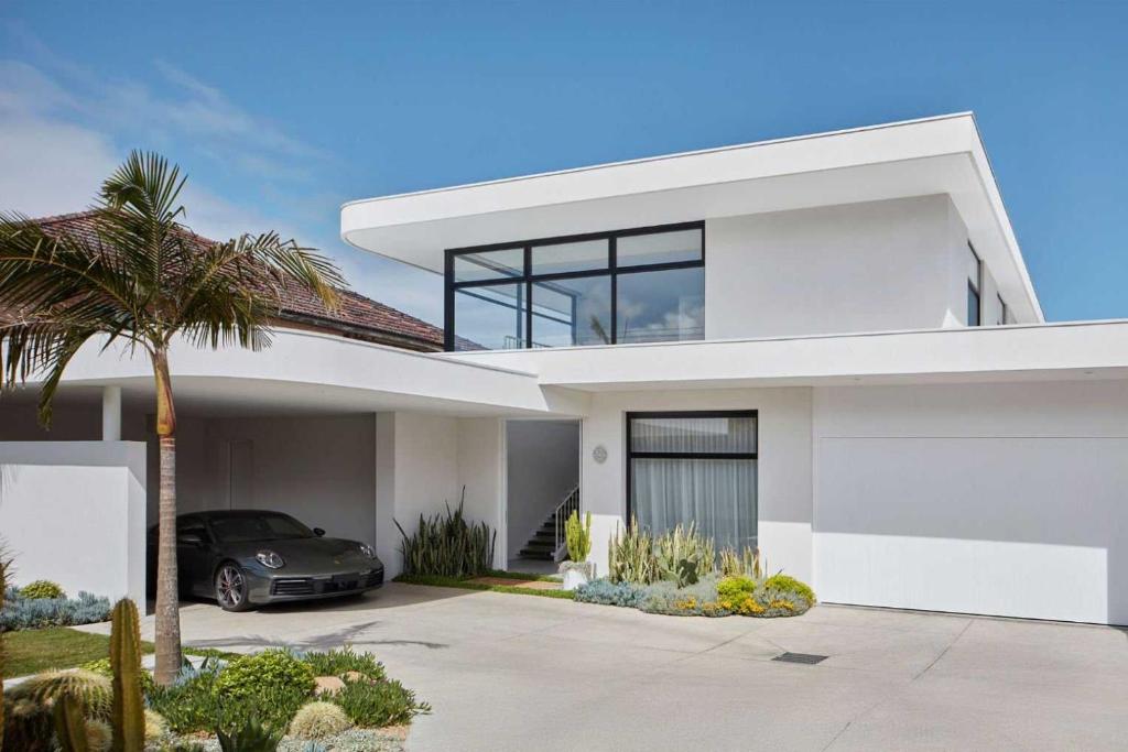 a house with a car parked in the driveway at RC Resort by Palette Homes I Kovalam Beach I ECR in Perunkalattu