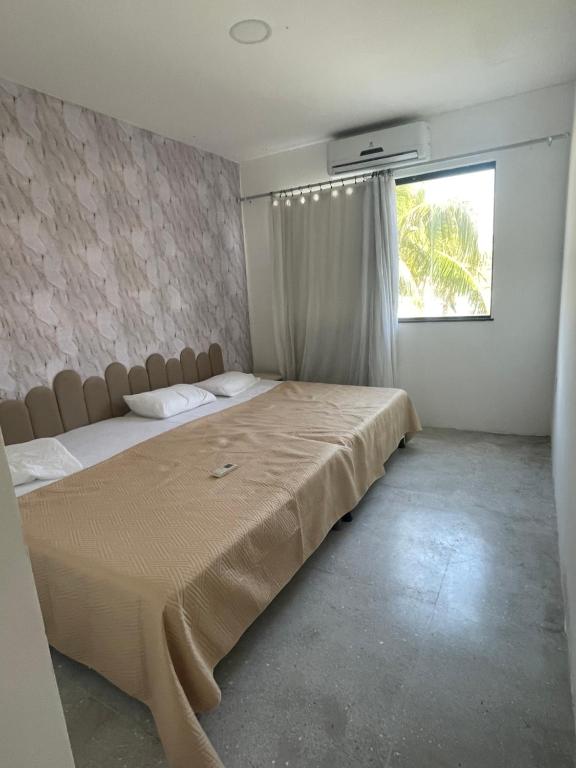 En eller flere senge i et værelse på mansaobarra Linda casa na Atalaia Nova