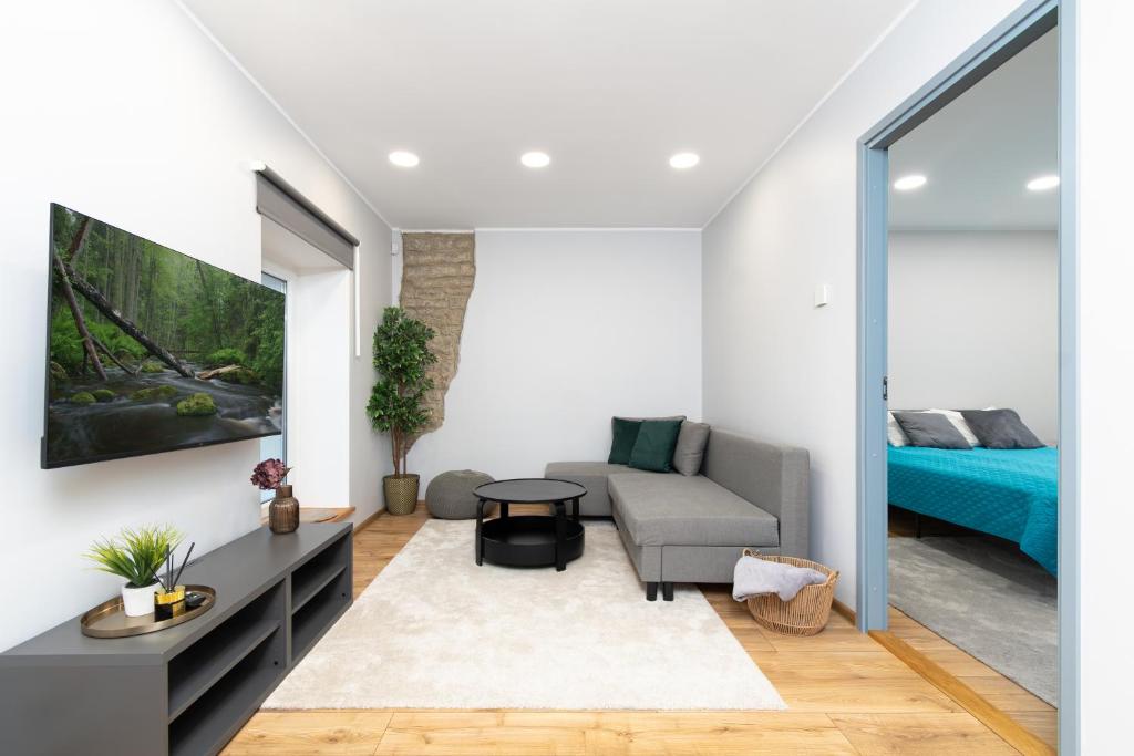 Postel nebo postele na pokoji v ubytování Kalma 7 Apartments