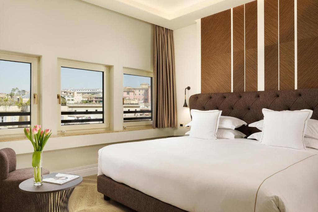 Giường trong phòng chung tại FH55 Grand Hotel Palatino