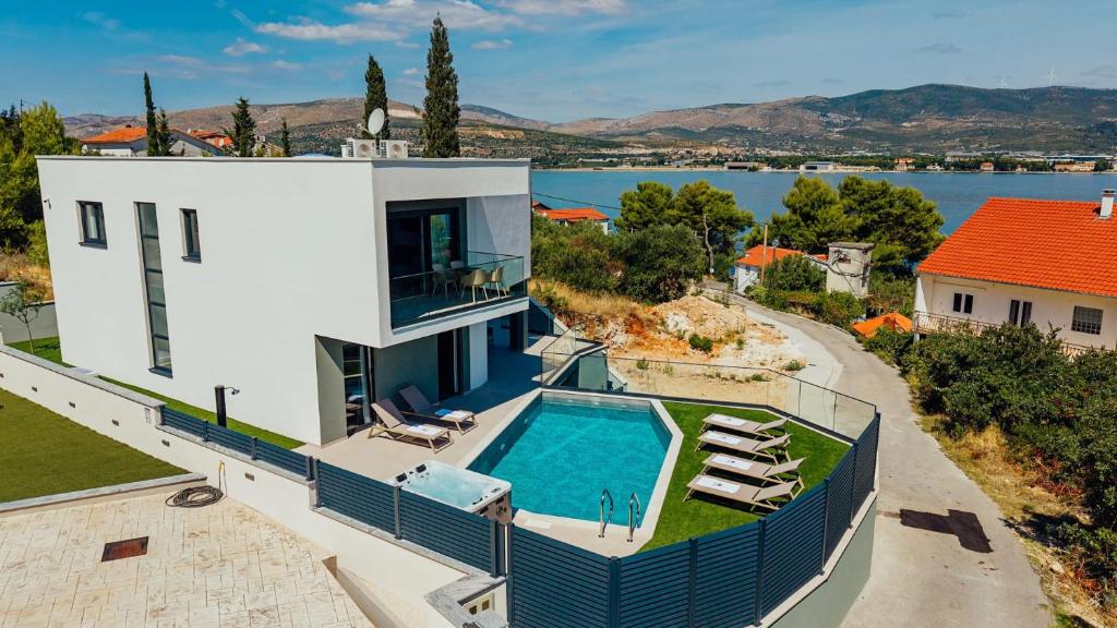 an aerial view of a house with a swimming pool at SEAPHORIA Luxury Modern Villa in Trogir
