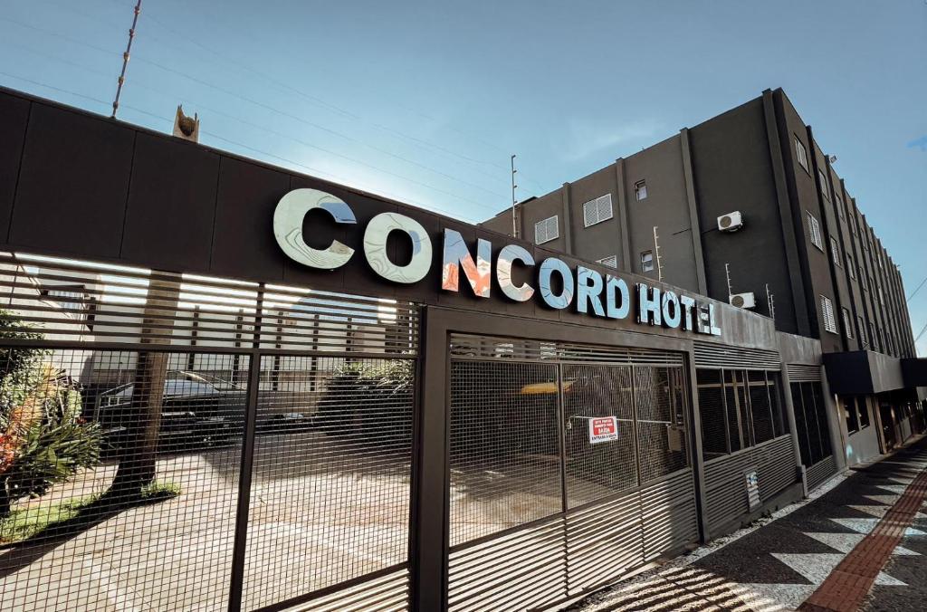 a concord hotel sign on the front of a building at Hotel Concord e Eventos corporativos Campo Grande in Campo Grande