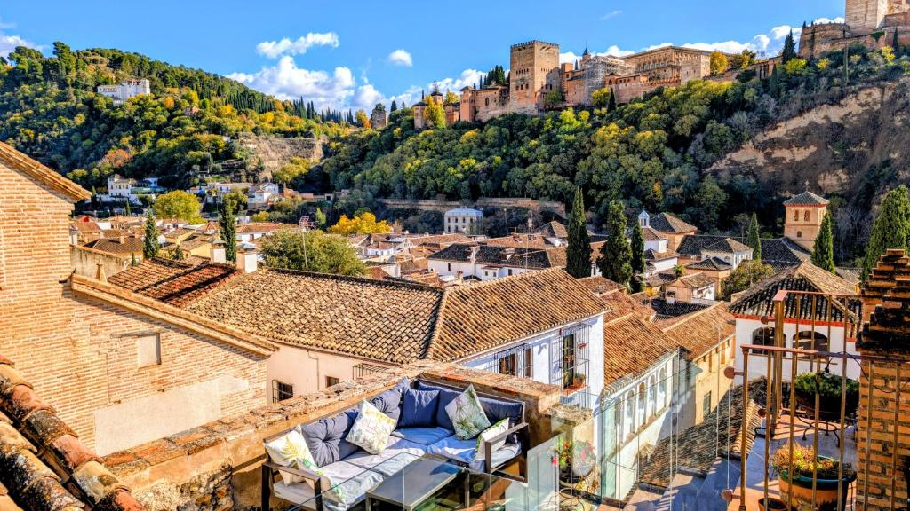a view of the city from the roof of a building at Apartamentos Alhambra in Granada