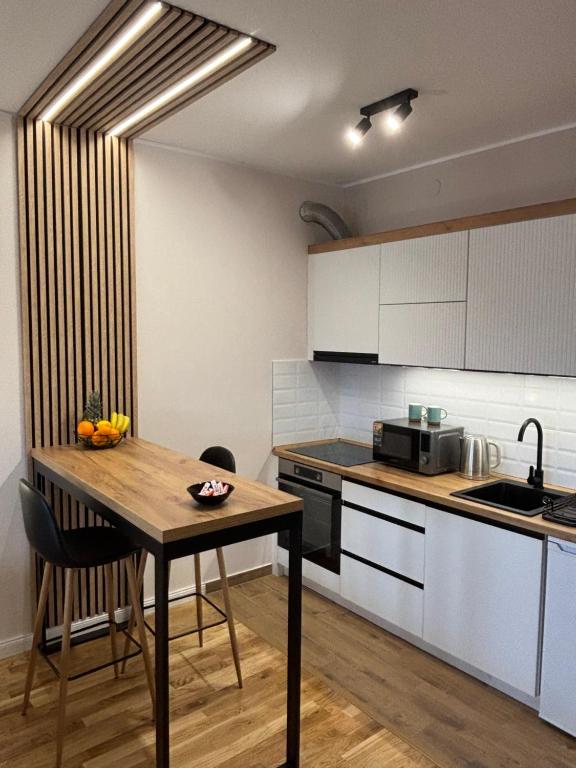 Kuchyň nebo kuchyňský kout v ubytování Apartman Panorama