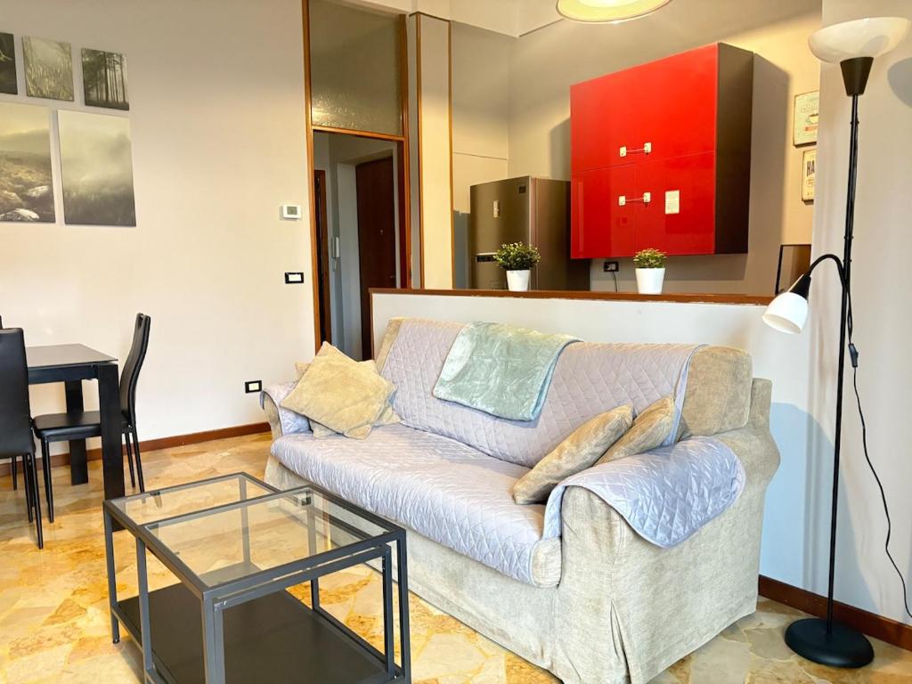 a living room with a couch and a table at Nova milanese design apartment in Nova Milanese