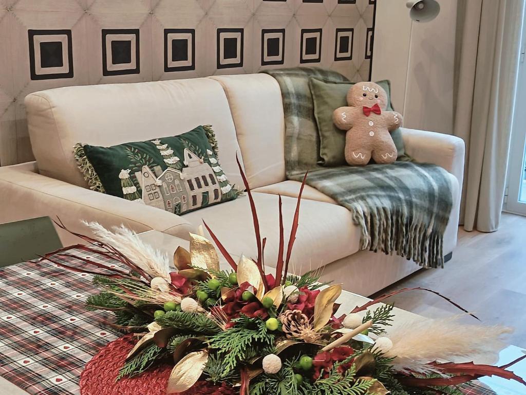 a teddy bear sitting on a chair in a living room at Sul Corso Sanremo in Sanremo