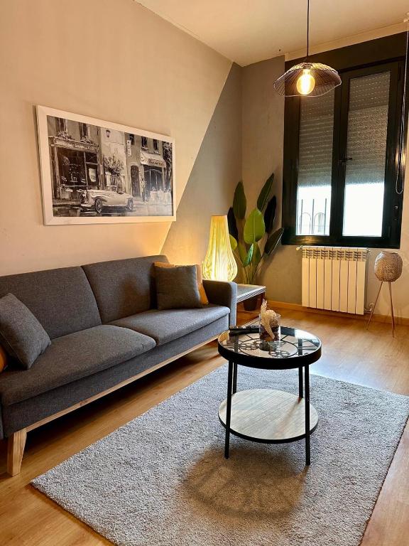 a living room with a couch and a table at Estancia en Bernuy SEGOVIA VUT-40-808 in Bernúy de Porreros