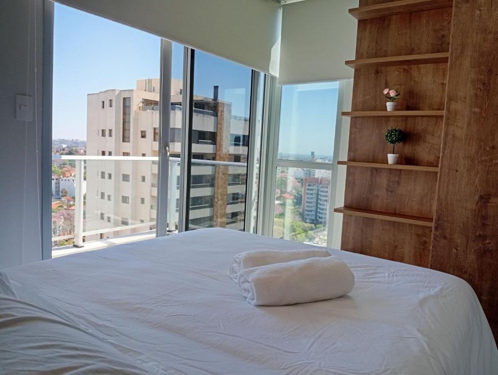 Ένα ή περισσότερα κρεβάτια σε δωμάτιο στο Loft a minutos del Shopping del Sol