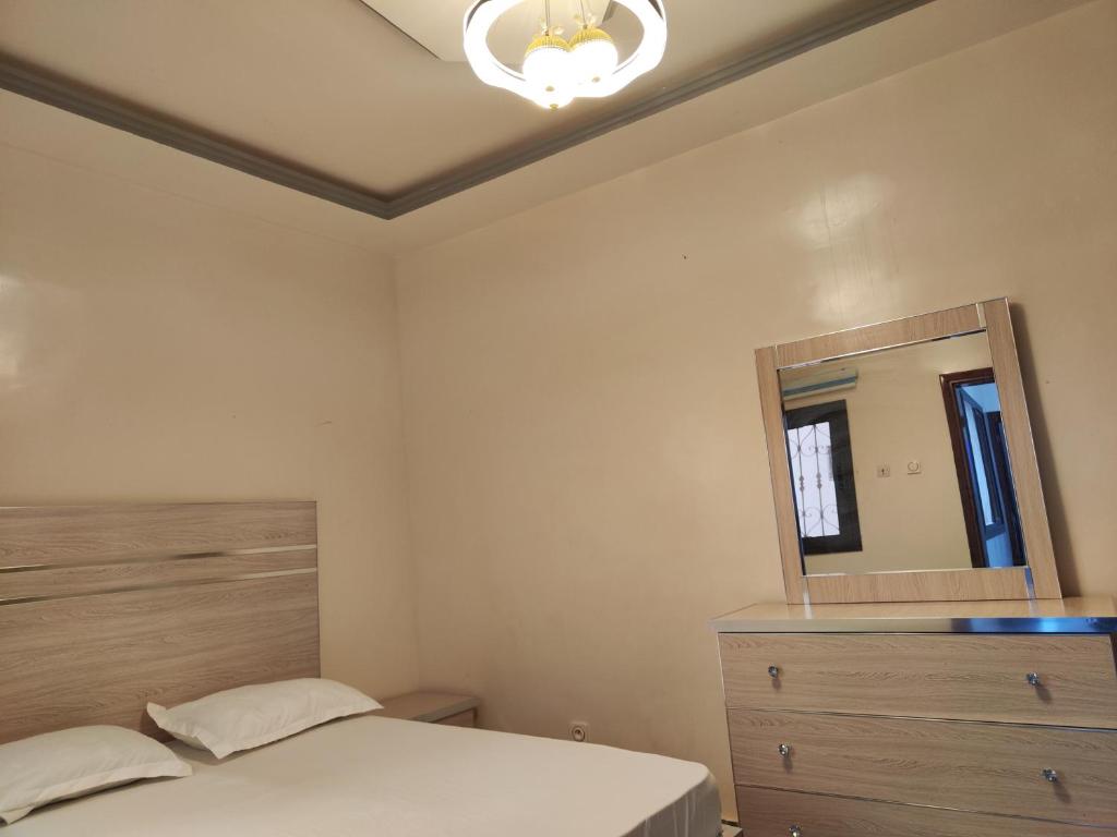 Ένα ή περισσότερα κρεβάτια σε δωμάτιο στο Résidence marie