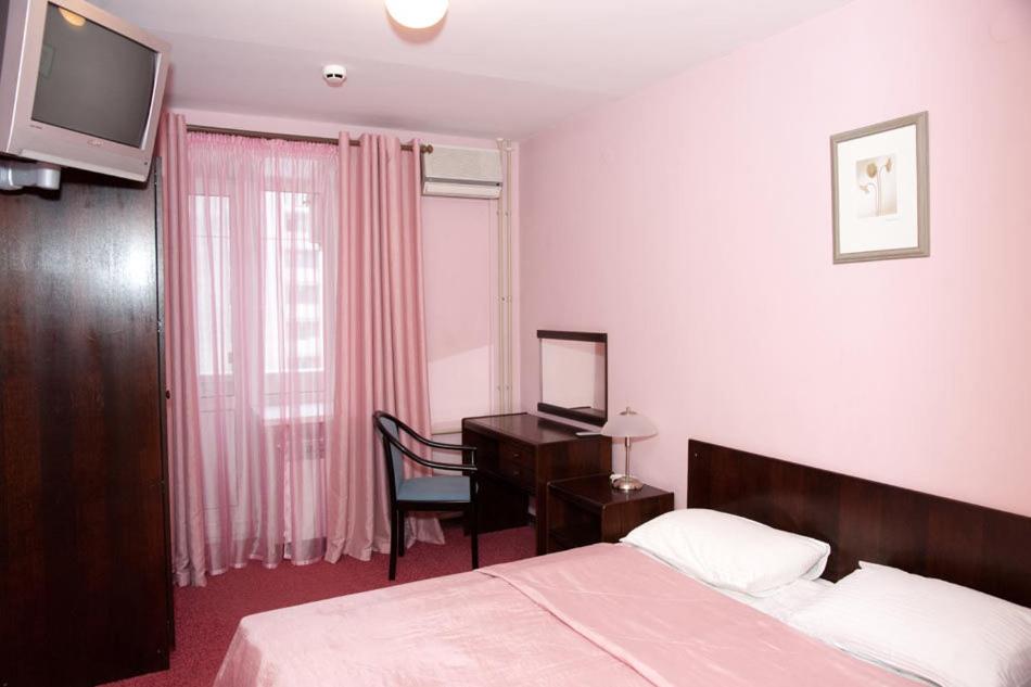 
Кровать или кровати в номере Апарт-Отель Загреб

