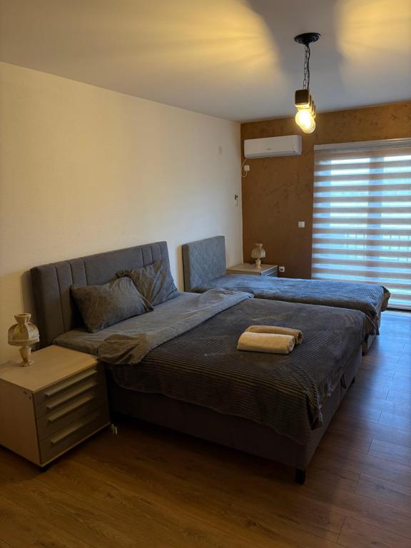 Ένα ή περισσότερα κρεβάτια σε δωμάτιο στο Apartman Ika 4N