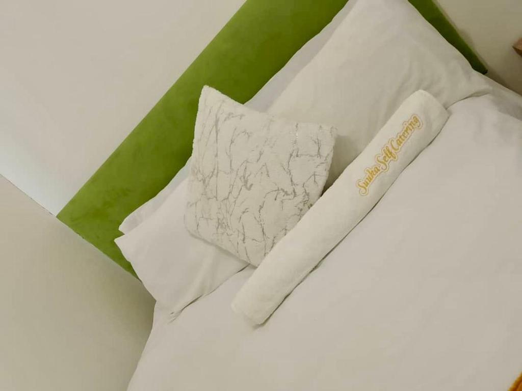 Postel nebo postele na pokoji v ubytování Suuka Guest House