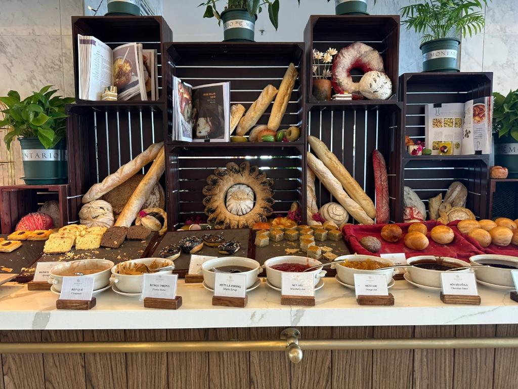 a display of different types of food on a table at Apec mandala Apartment - APEC Mandala Ocean View Mũi né-R0234 in Mui Ne