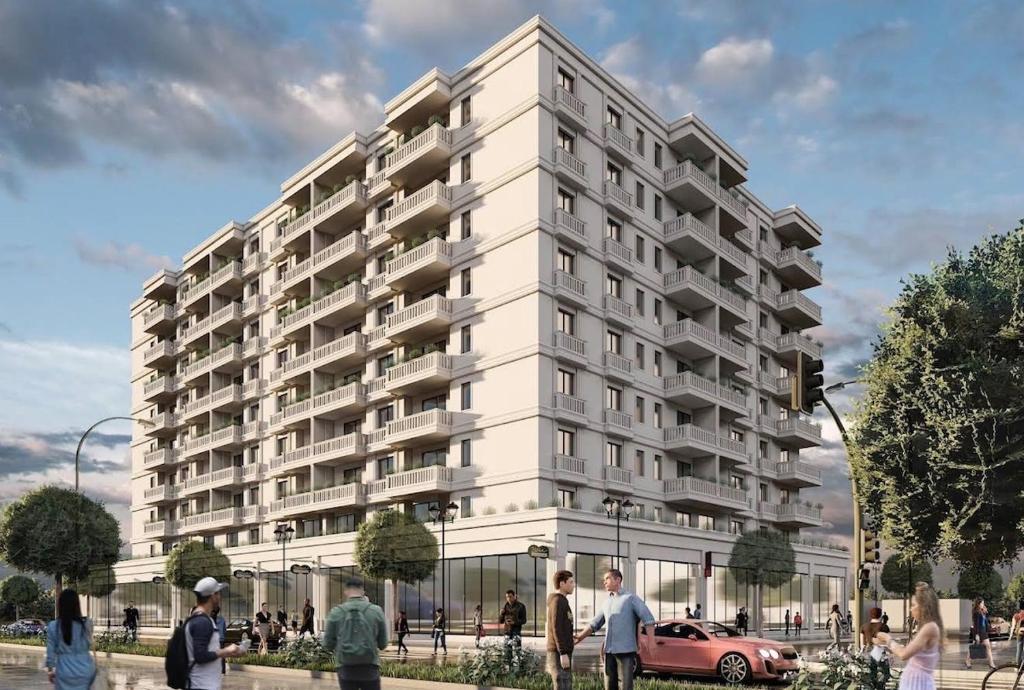 a rendering of a large white apartment building at Modern 2-Bed Near Tirana and Airport with Balconies in Kamëz