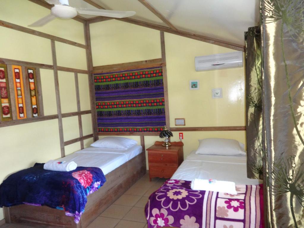 A bed or beds in a room at cocopeleinn2