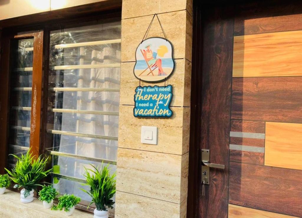 a sign on the side of a building at The Healing Haven in Kharar