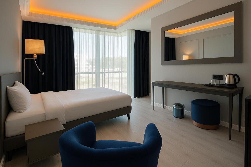 En eller flere senge i et værelse på Loft Airport Hotel