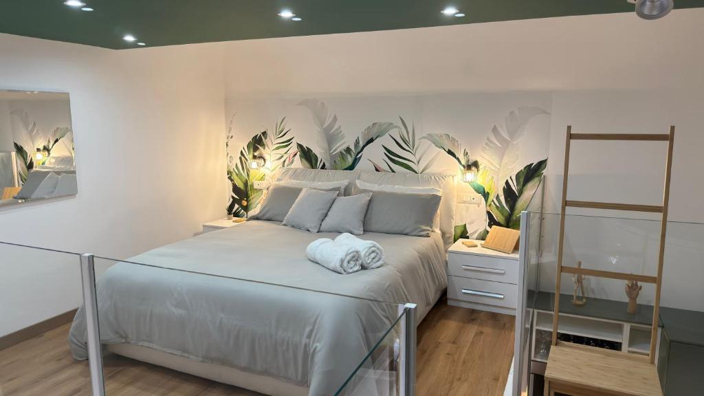 a bedroom with a large bed with a plant wall at Figli Di Agata in Catania