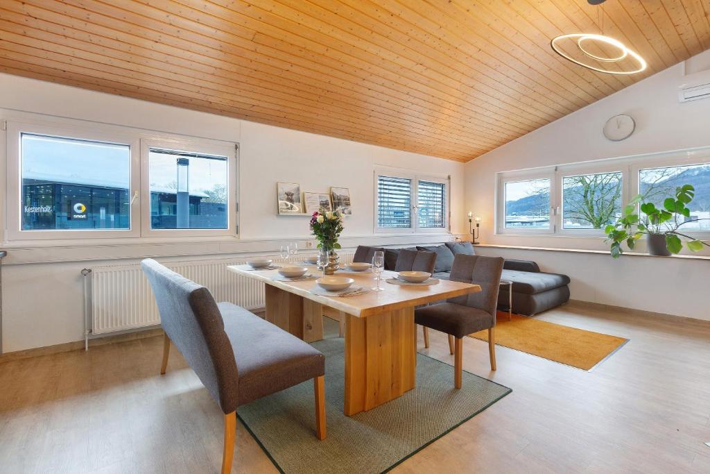 a living room with a table and chairs and a couch at Motel Ambiente - 4 Zimmer, 2 Bäder in Bad Säckingen