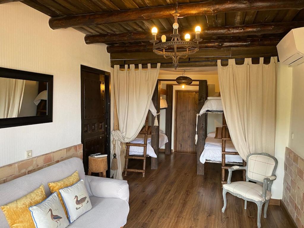 En eller flere senge i et værelse på Finca Fuente Magan