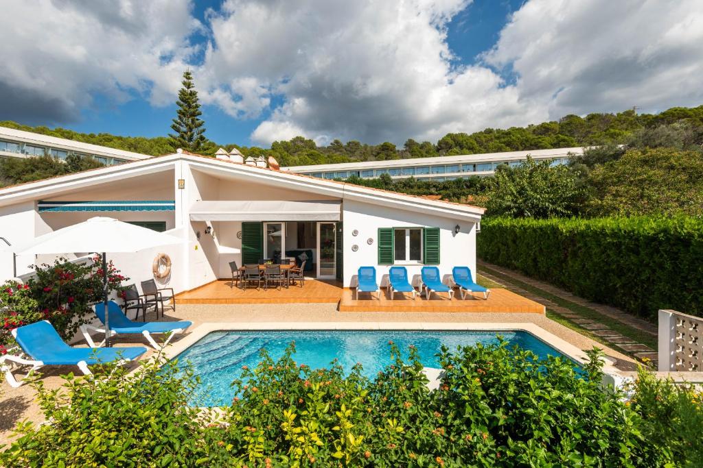 a villa with a swimming pool and a house at Villa Noelia by Escape Home in Santo Tomás