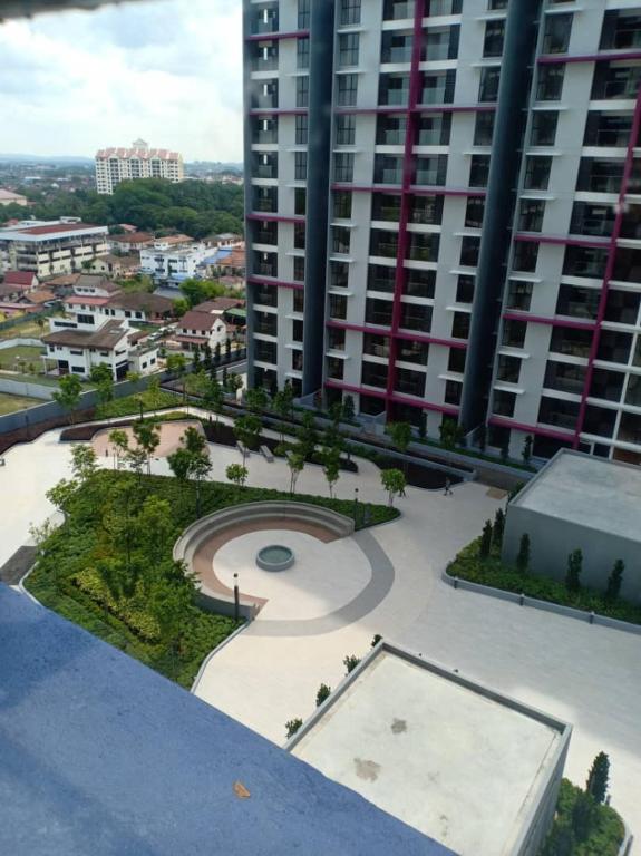 an aerial view of a city with a large building at DHome Laksamana Melaka in Malacca