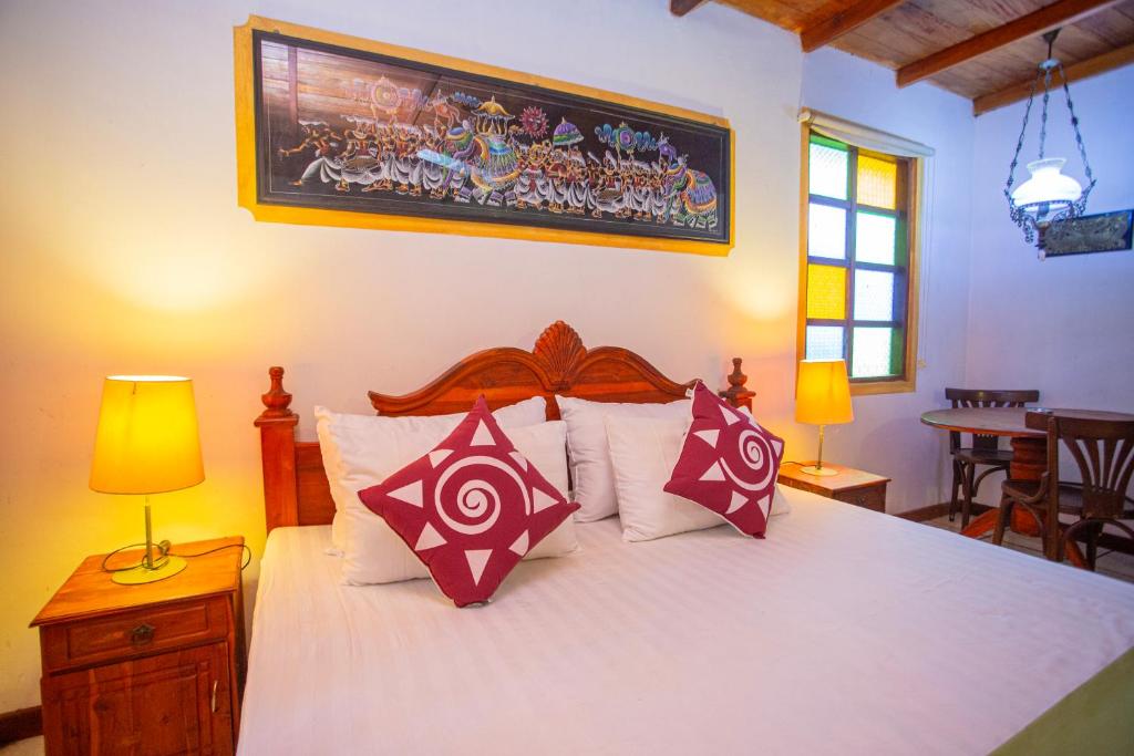 Ένα ή περισσότερα κρεβάτια σε δωμάτιο στο Golden Villa Hikkaduwa