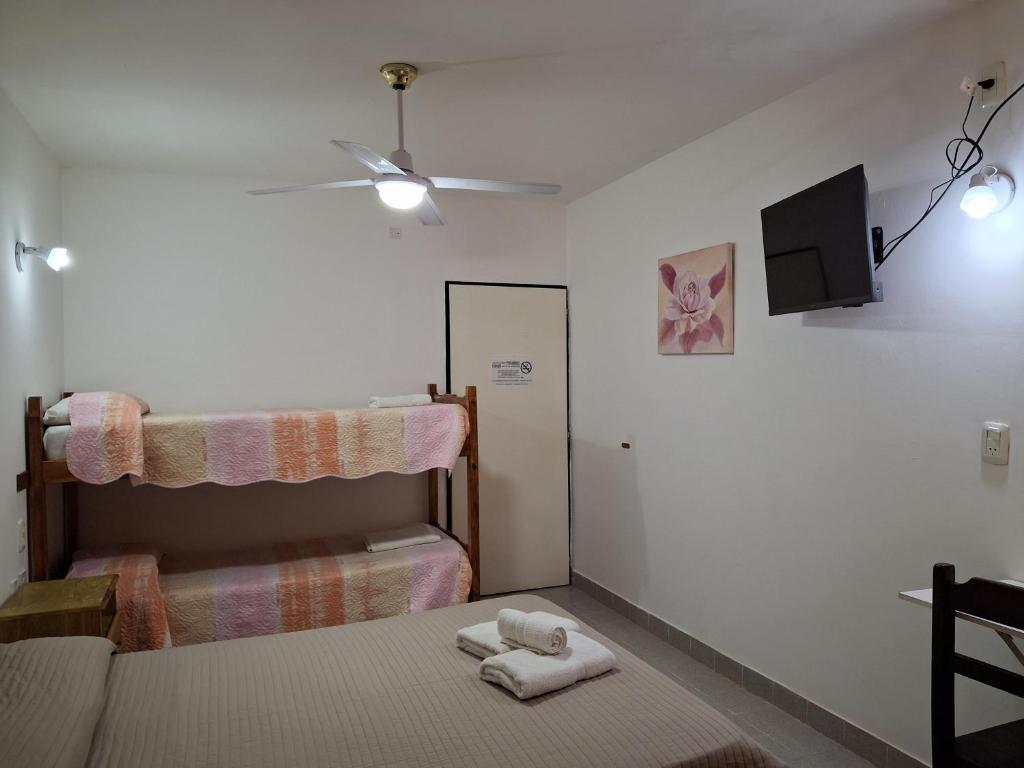 Кровать или кровати в номере Hotel Residencial Lo de Pepe