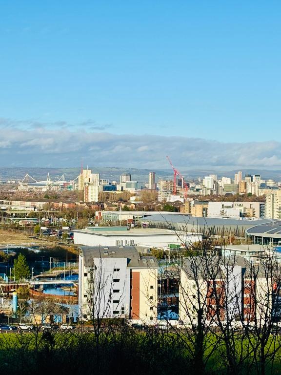 a view of a city with buildings in the background at 4 bed Townhouse with spectacular views 4 miles from Cardiff 10min drive or train journey to city centre in Cardiff