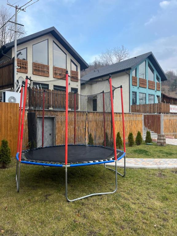 a trampoline in a yard in front of a house at Two Dilijan in Dilijan