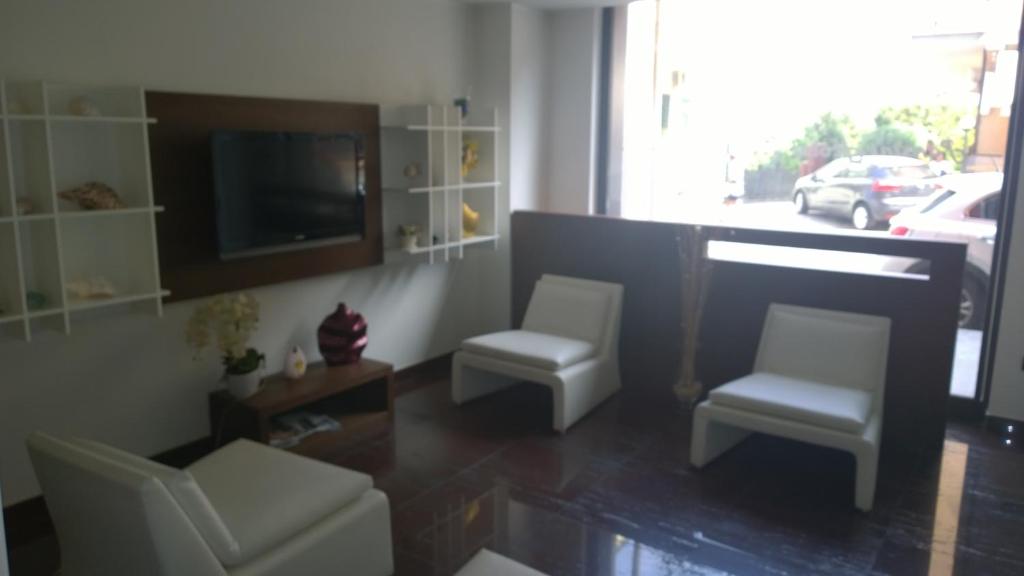 TV a/nebo společenská místnost v ubytování Pansini Hotel Residence