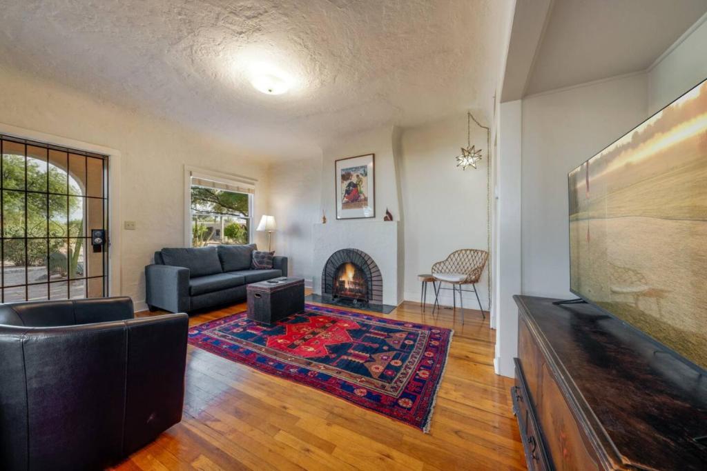 a living room with a couch and a fireplace at Casita #7 in Tucson