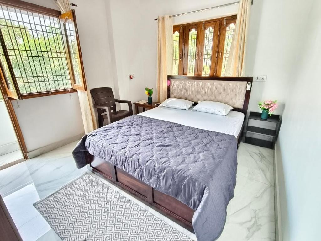 Ένα ή περισσότερα κρεβάτια σε δωμάτιο στο Prasads Homestay