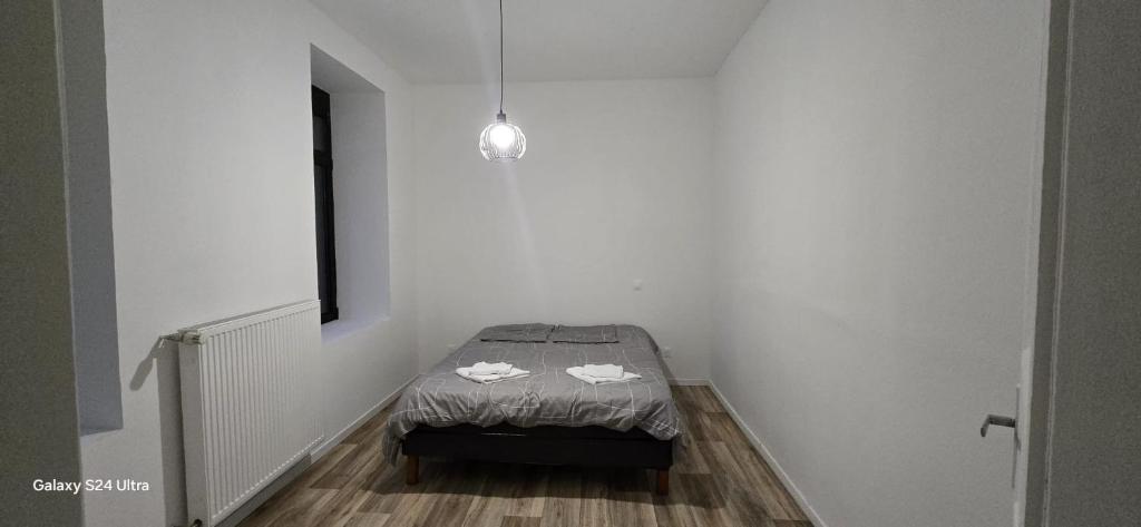 a small room with a small bed in the corner at Homeday joffre 2 type F2 Haguenau in Haguenau