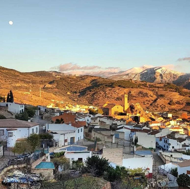 an aerial view of a village in the mountains at Alojamiento rural casa cueva abuelo Miguel in Pegalajar