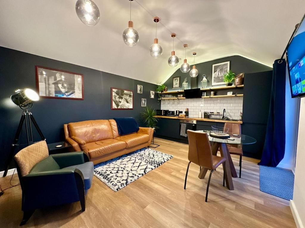 a living room with a couch and a table at The Annexe in Yeovil Junction